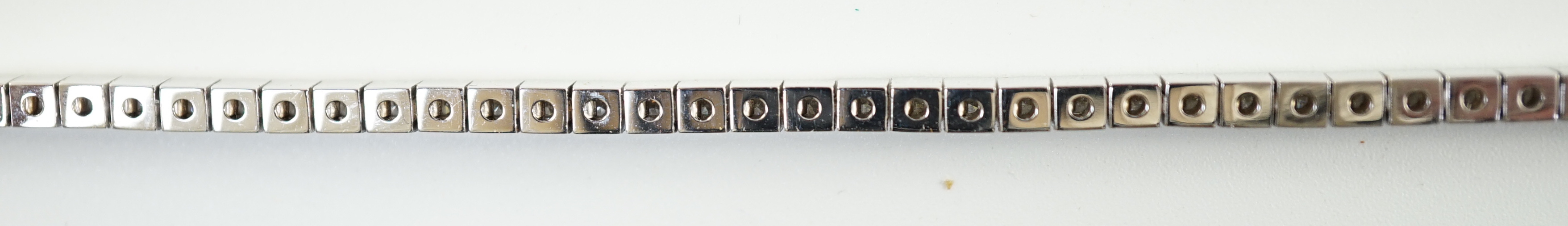 A late 20th century Cartier 18ct white gold and diamond set line bracelet